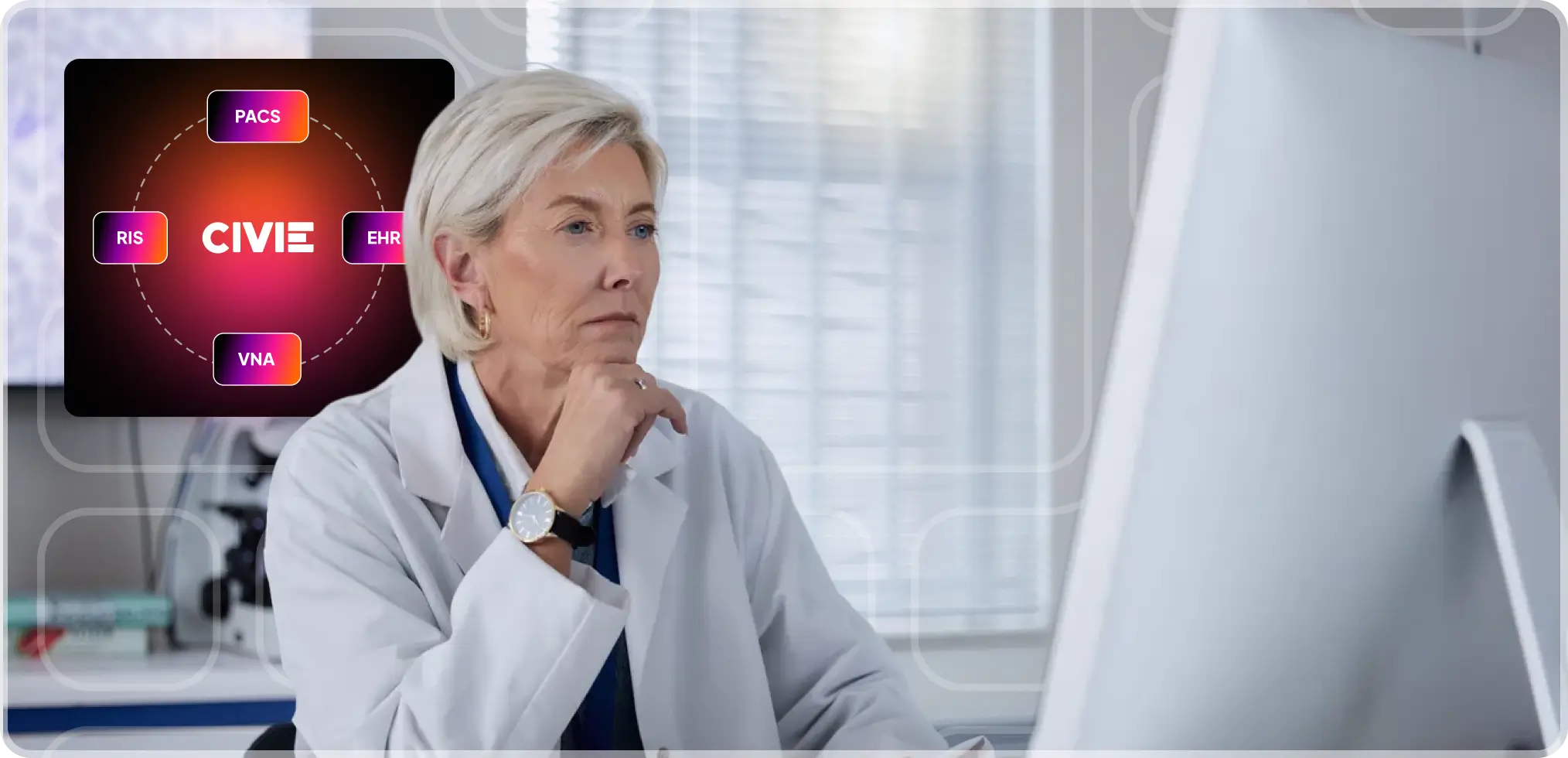 A healthcare professional reviewing information on a computer with an interoperability system graphic displayed.